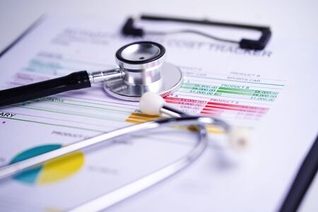 Stethoscope, Charts and Graphs spreadsheet paper, Finance, Account, Statistics, Investment, Analytic research data economy spreadsheet and Business company concept.の写真素材