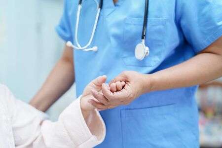 Holding Touching hands Asian senior or elderly old lady woman patient with love, care, helping,...
