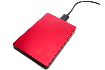 Red external hard disk isolated on white background.
