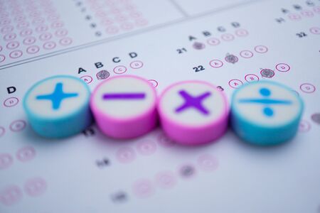 Math symbol and pencil on Answer sheet background : Education study mathematics learning teach concept.の写真素材