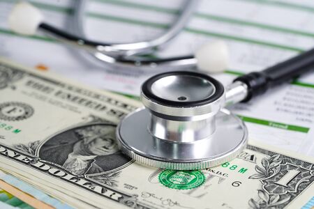 Stethoscope, Charts and Graphs spreadsheet paper, Finance, Account, Statistics, Investment, Analytic research data economy spreadsheet and Business company concept.の写真素材