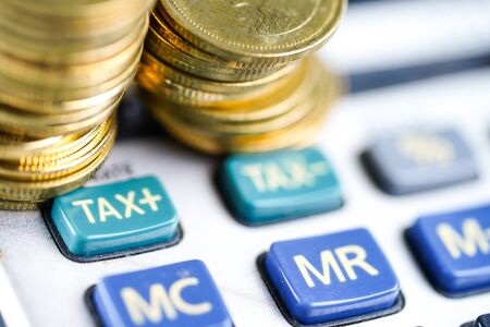 Saving stack coins on calculator. Finance, Account, Statistics, Analytic research data economy, Stock exchange trading and Business company meeting conceptの写真素材