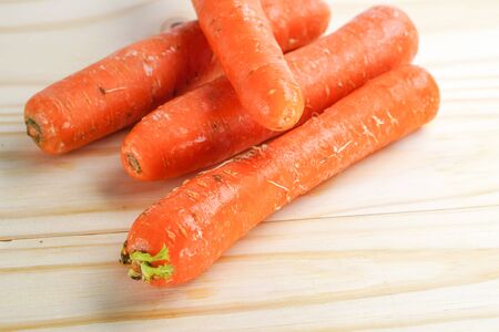 Fresh carrot on wooden background.の写真素材