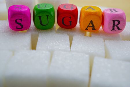 Sugar sweet cubes with colorful english alphabet high calories : fat diet healthy food concept.の写真素材