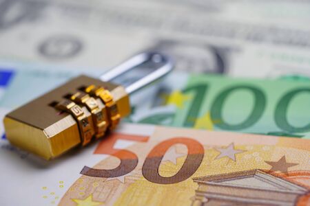 Golden security digital password lock key on Euro banknotes : Finance security concept.の写真素材