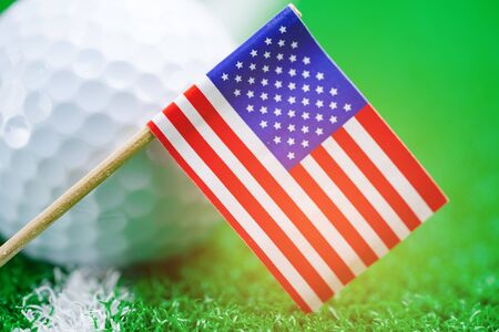 Golf ball with USA flag on green lawn or field : most popular sport in the world.の写真素材
