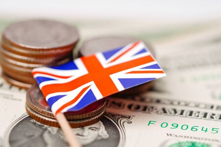 England flag with coins on dollar banknotes background :  Banking Account, Investment Analytic...