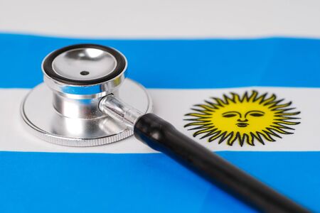 Black stethoscope on Argentina flag background : Business and finance concept.の写真素材