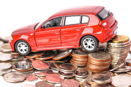 BANGKOK, THAILAND - FEBRUARY 18, 2020 : Car on coins background : Car loan, Finance, saving money, insurance and leasing time concepts.のeditorial素材