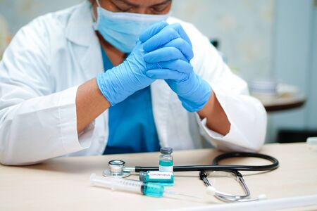 Doctor worry and strain about Novel Coronavirus (2019-nCoV) Covid-19 vaccine development medical...