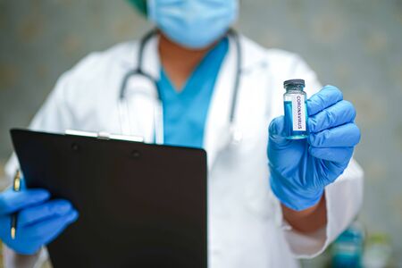 Novel Coronavirus (2019-nCoV) Covid-19 vaccine development medical with syringe for doctor use to treat pneumonia illness patients.の写真素材