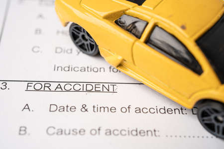 Car on Insurance  claim accident  form, Car loan, insurance and leasing time concepts.のeditorial素材