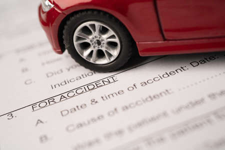 Stethoscope on Insurance  claim accident car form, Car loan, insurance and leasing time concepts.の写真素材