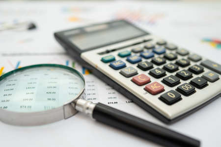Calculator on chart and graph spreadsheet paper. Finance development, Banking Account, Statistics, Investment Analytic research data economy, Stock exchange trading, Business company concept.の写真素材