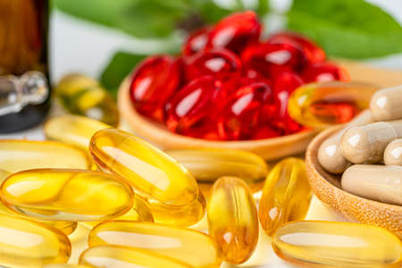 Alternative medicine herbal organic capsule with vitamin E omega 3 fish oil, mineral, drug with...
