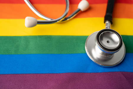 Black stethoscope on rainbow flag backgroundの写真素材