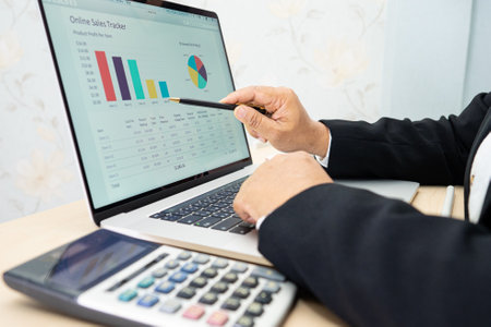 Asian accountant type keyboard to enter information, working, calculate and analyzing report chart...