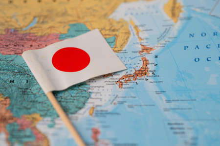 Bangkok, Thailand - February 7, 2021; Japan flag on world map background.の写真素材