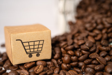 Box with shopping cart logo symbol on coffee beans, Import Export Shopping online or eCommerce delivery service store product shipping, trade, supplier concept.の写真素材