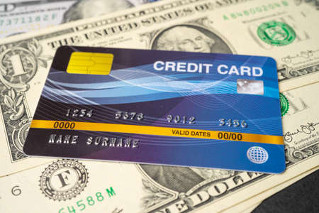 Credit card model on US dollar banknotes, Finance development, Banking Account, Statistics, Investment Analytic research data economy, Stock exchange trading, Business company concept.の写真素材