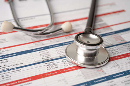 Stethoscope on spreadsheet paper, Finance, Account, Statistics, Investment, Analytic research data...