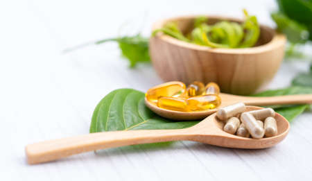 Alternative medicine herbal organic capsule with vitamin E omega 3 fish oil, mineral, drug with herbs leaf natural supplements for healthy good life.の写真素材