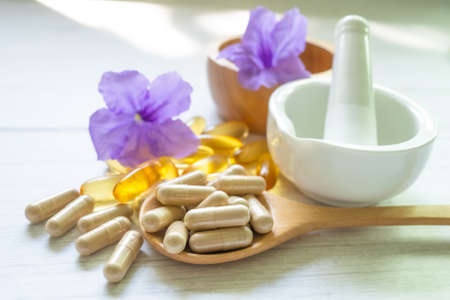 Alternative medicine herbal organic capsule with vitamin E omega 3 fish oil, mineral, drug with herbs leaf natural supplements for healthy good life.の写真素材