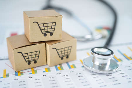 Stethoscope and shopping cart logo on box with graph background. Banking Account, Investment Analytic research data economy, trading, Business import export transportation online company concept.の写真素材