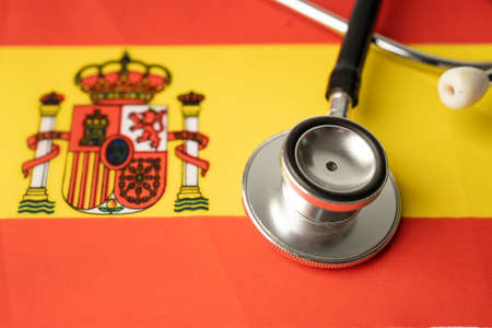 Black stethoscope on Spain flag background, Business and finance concept.の写真素材