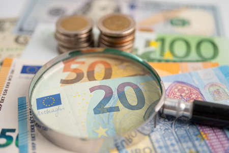 Magnifying glass and Euro banknotes background, Banking Account, Investment Analytic research data economy, trading, Business company concept.の写真素材
