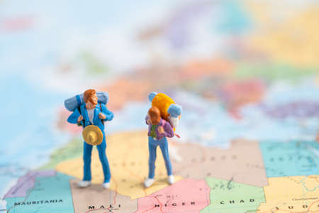 Bangkok, Thailand, July 30, 2021 Miniature people, Two backpacker enjoy to discovery journey travel at amazing on world map.の写真素材