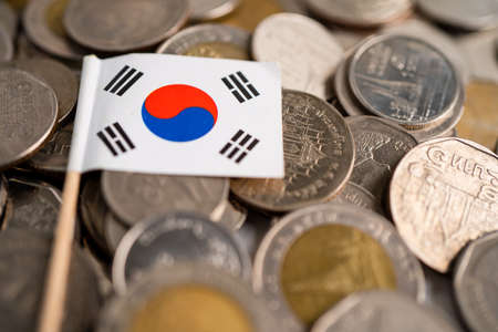 Stack of coins with Korea flag on white background. flag on white background.の写真素材