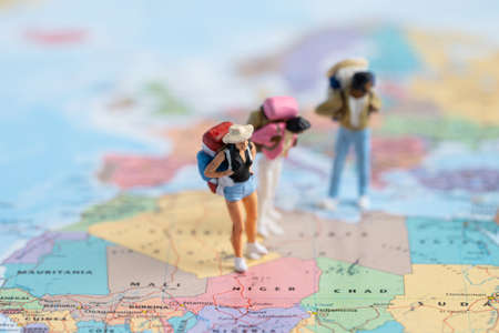 Bangkok, Thailand, July 30, 2021 Miniature people,Backpacker enjoy to discovery journey travel at amazing on world map.のeditorial素材