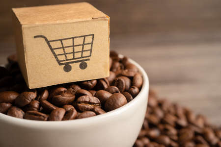 Box with shopping cart logo symbol on coffee beans, Import Export Shopping online or eCommerce...