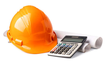 Orange construction helmet isolated with calculator on white background with  , engineer concept.の写真素材
