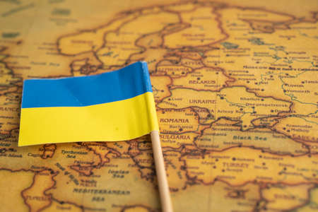 Bangkok, Thailand - February 1, 2022 Ukraine flag on vintage world map background.のeditorial素材