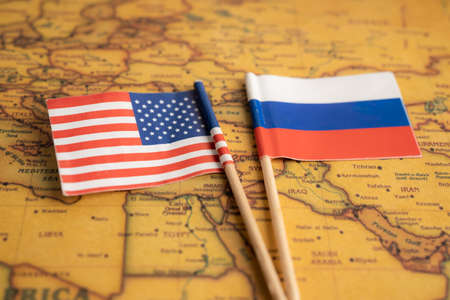 Bangkok, Thailand - February 1, 2022 Russia and USA America flag on vintage world map background.のeditorial素材