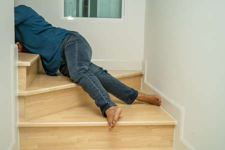 Asian lady woman patient fall down the stairs because slippery surfacesの写真素材