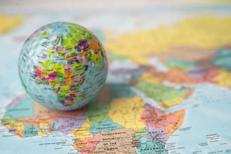 Bangkok, Thailand, May 1, 2021 Africa map at golf ball with flag on world globe map.のeditorial素材