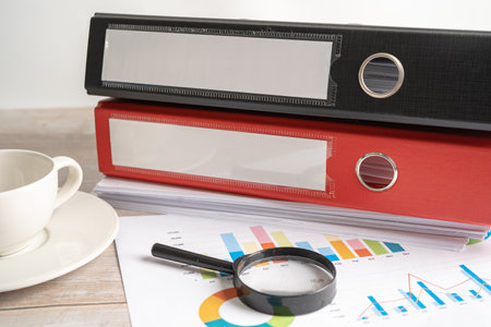Binder data finance report business with graph analysis in office.