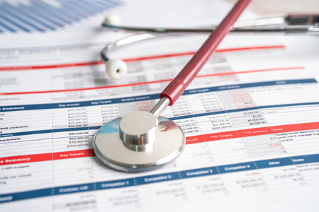 Stethoscope on spreadsheet paper, Finance, Account, Statistics, Investment, Analytic research data economy spreadsheet and Business company concept.の写真素材