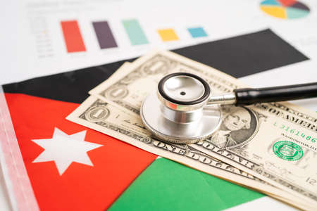 Black stethoscope on Jordan flag background with graph, Business and finance concept. flag background with US dollar banknotes, Business and finance concept.の写真素材