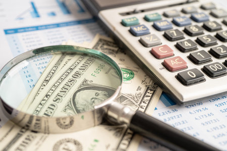 Magnifying glass on charts graphs paper. Financial development, Banking Account, Statistics, Investment Analytic research data economy, Stock exchange trading, Business office company meeting concept.の写真素材