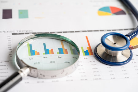 Stethoscope on charts and graphs paper, Finance, Account, Statistics, Investment, Analytic research...