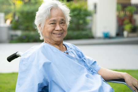 Asian senior or elderly old lady woman patient on wheelchair at nursing hospital ward, healthy strong medical concept.の写真素材