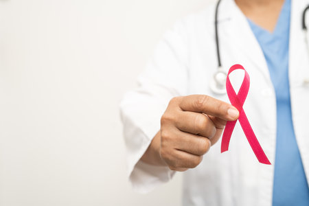 Breast cancer, Asian doctor woman with pink ribbon, symbol of World Breast Cancer Day.の写真素材