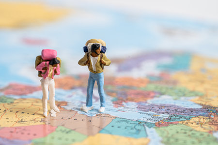 Bangkok, Thailand, July 30, 2022 Miniature people,Backpacker enjoy to discovery journey travel at amazing on world map.のeditorial素材