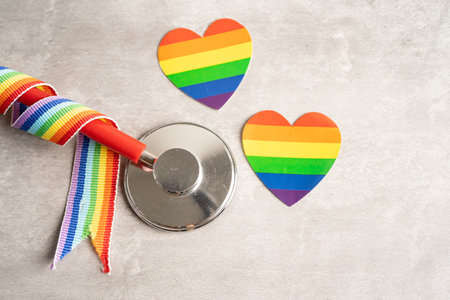 stethoscope on rainbow flag background, symbol of LGBT pride month  celebrate annual in June social,...