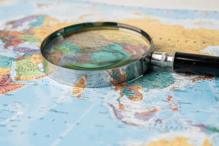 Bangkok, Thailand - May 01, 2022 Africa, Magnifying glass close up with colorful world map.のeditorial素材