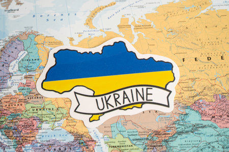 Bangkok, Thailand February 7, 2022, Ukraine flag symbol on world map background.のeditorial素材